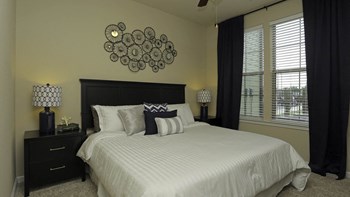 Carpeted Bedroom With Tall Ceilings